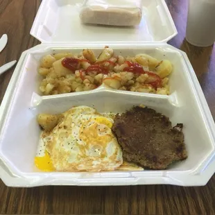 a meal in a styrofoam container