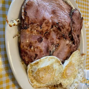 Ham steak with two eggs