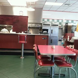 Real diner tables &amp; chairs. Cuter inside than I expected for restaurant attached to gas station.