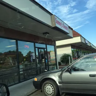 a car parked in front of a restaurant