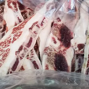 a bunch of meat wrapped in plastic