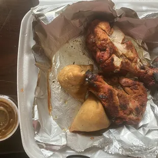 2pc chicken tikka and 2pc samosas with a shot of chutney on the side.