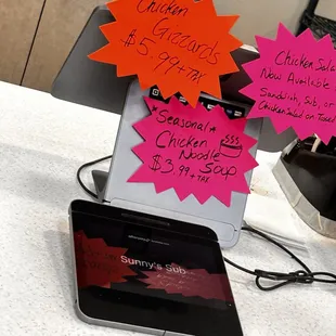 a laptop and a tablet on a counter
