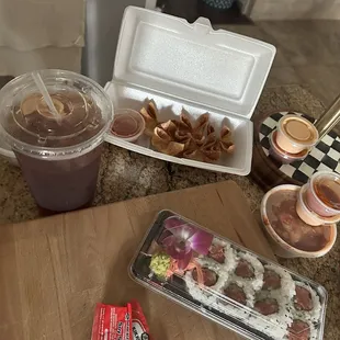 Crab meat puff, spicy tuna roll, miso soup, cucumber kimchi, and an iced tea