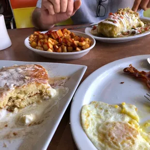 Chimichanga, home fries, GF pancakes, bacon and eggs.