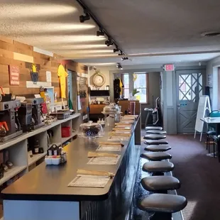 a long bar with stools
