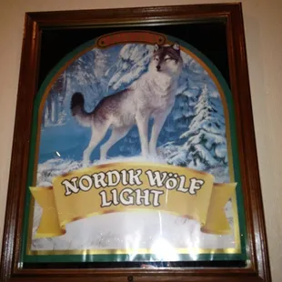 a picture of a wolf in the snow