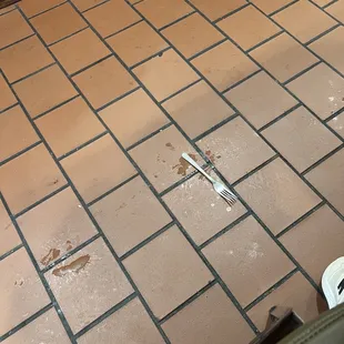 Dirty floor and fork