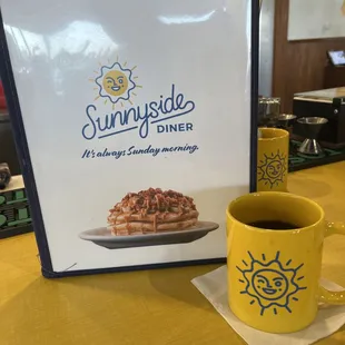 a cup of coffee and a plate of waffles