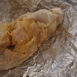 a piece of food wrapped in foil