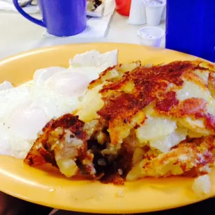 Eggs over easy with home fries. Toast on a separate plate.