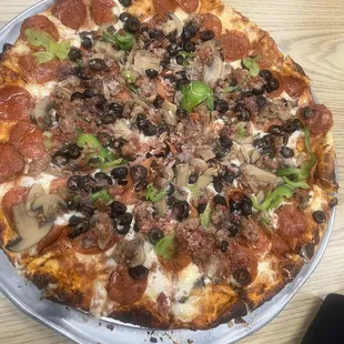 Family size combination pizza with unique linguica instead of Italian sausage