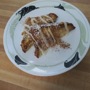 a plate of food on a wooden table