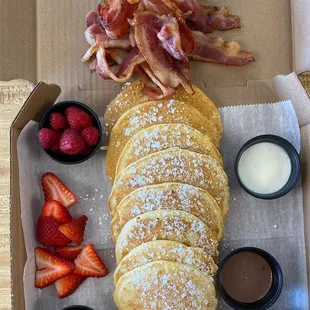 Pancake Board  $25, Mini Pancakes, Bacon, Fresh Fruit, Nutella, Vanilla Buttercream. Feeds approx 4