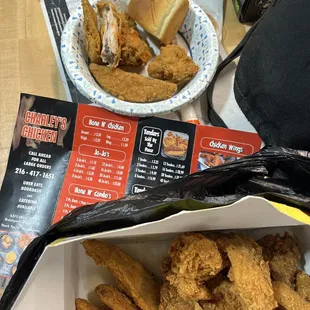 Chicken, Joe Joe's, and sweet Hawaiian roll with a side of hot sauce.