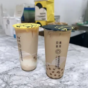 White peach oolong milk tea w/ honey boba &amp; cream pudding + Oolong milk tea w/ honey boba