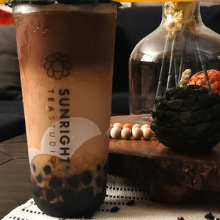 Pumpkin Spice Espresso Latte with boba and oatmilk.