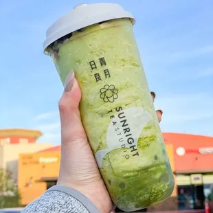 Matcha slush with boba and red bean topping