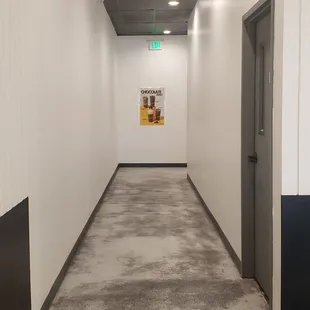 To the restroom in the back