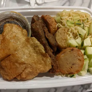 Empek-Empek: Savory Indonesian fish cake (made with tapioca flour) served w/ spicy sweet-and-sour sauce, yellow noodles, &amp; cucumber