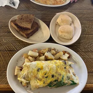 Custom omelettes, biscuit, raisin bread