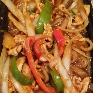 Thai Basil Chicken with onions, mushrooms, and peppers in a brown basil sauce. Fresh and tasty!