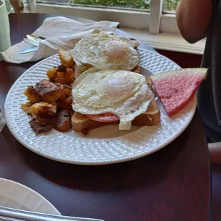 a plate of breakfast food on a table