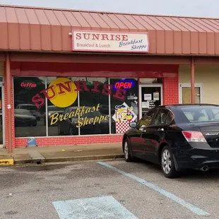 Parking lot. Do not let the exterior deter you. This place is great!