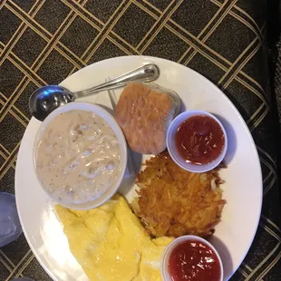Biscuit and gravy, scrambled eggs and hash brown