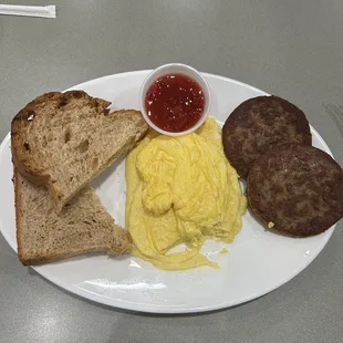 Combination 3, 2 scrambled eggs, 2 sausage patties and 2 slices of toast with strawberry preserves.