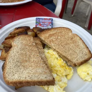 Scrambled eggs toast and potatoes