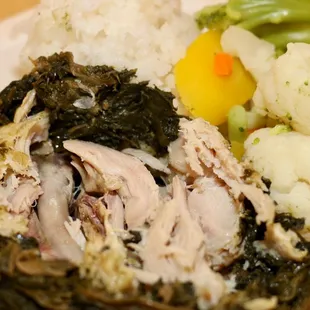 a plate of food with meat, vegetables, and rice