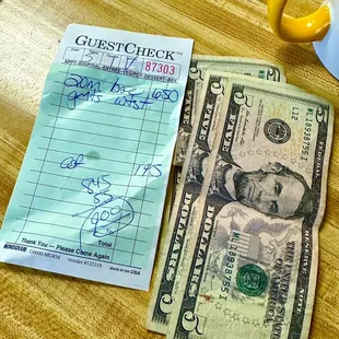 two bills and a cup of coffee