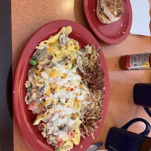 Sunrise omelet and has browns, side biscuit