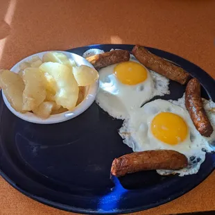 Spiced apples, sunny side up eggs, turkey sausage