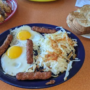 Traditional three option w sunnyside up eggs, turkey sausage, hashbrowns and wheat toast