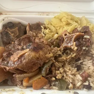 Oxtails , rice and peas and cabbage
