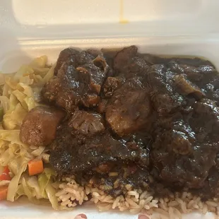 Medium oxtail plate with rice and Steamed Cabbage.