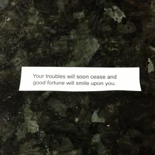 a sign saying your troubles will soon cease and good fortune will smile up upon you