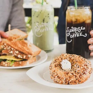 Our Everything Bagel and Multigrain Egg Sandwich paired with our classic Cold Brew and an iced Matcha Latte