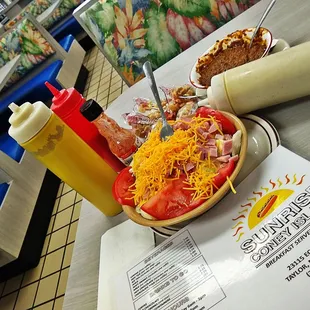 a bowl of salad and a sandwich