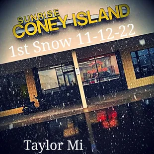 a man sitting on a bench in the rain