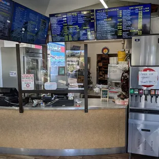 the counter and menus of the restaurant