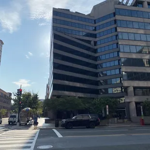 The deli is to the right of the main doors of this office building.
