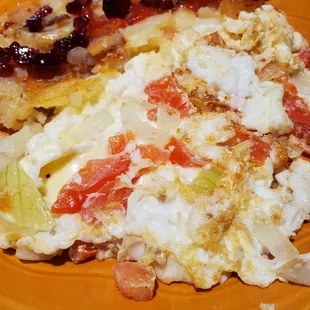 Egg white omelet with tomato, onions and American cheese with home fries and grape jelly, omelet was a little over done.