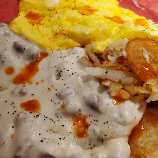 Sausage gravy &amp; biscuits with a side of 3 scrambled eggs and home fries, a bit of hot sauce.