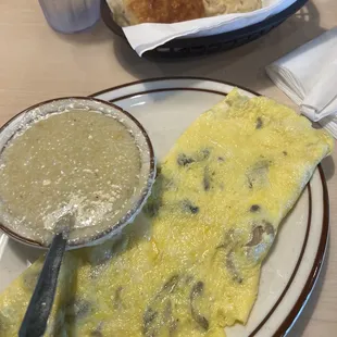 Mushroom cheese omelette grits and biscuits