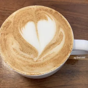 a cappuccino with a heart in the foam