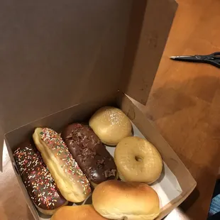 two kolaches, chocolate bacon bar, chocolate sprinkles bar, maple sprinkles bar, some lemon donut (i think), and a classic glazed