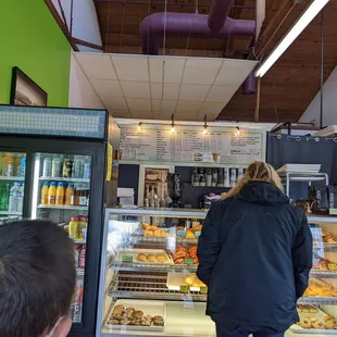 a woman standing in front of the counter